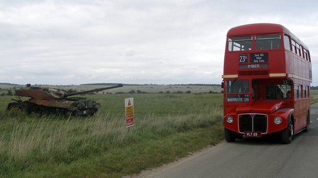 Bus by a tank on Salisbury Plain