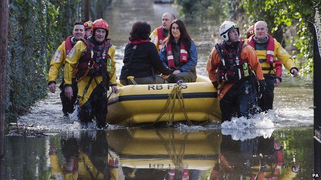 Berkshire fire and rescue crews rescue residents whose houses have been flooded in Staines-upon-Thames