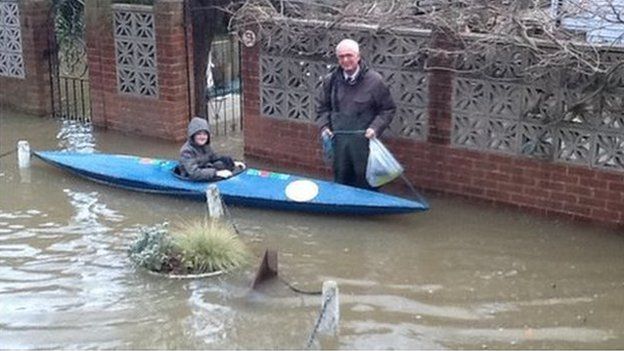 Schoolboy in a canoe in Thames Ditton