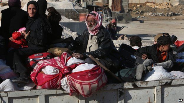 A Syrian family flees Yabroud in the back of a truck. Photo: 12 February 2014