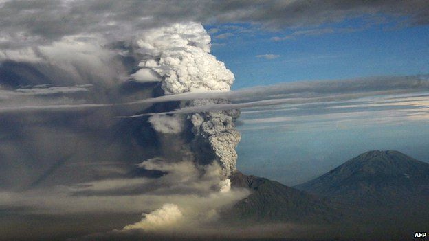 A plume of gas and ash billowing from the Mount Merapi volcano during an eruption on 4 November 2010