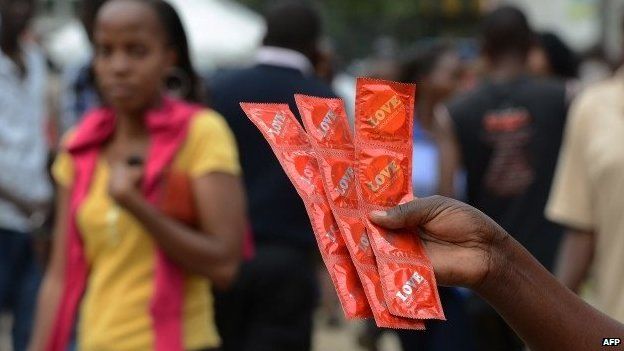 Volunteer distributing condoms in Kenya