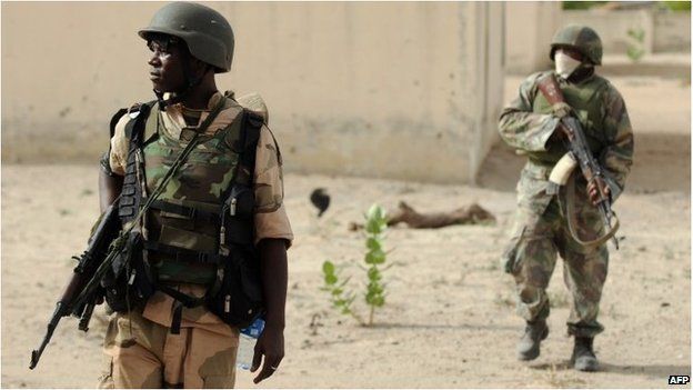 Nigerian soldiers patrol in the north of Borno state close to a Islamist extremist group Boko Haram former camp, file image from 2013