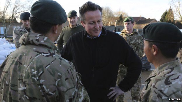 David Cameron meets soldiers from the 2nd battalion Royal Gurkha Rifles, at a military command centre in Chertsey