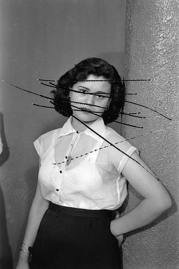 portrait of a woman with her face scratched out