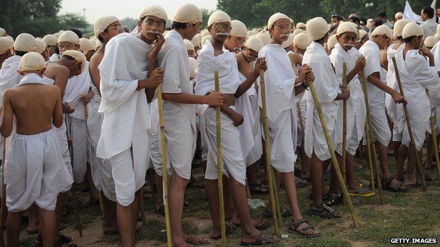 Group of Indian students dressed as Mahatma Gandhi