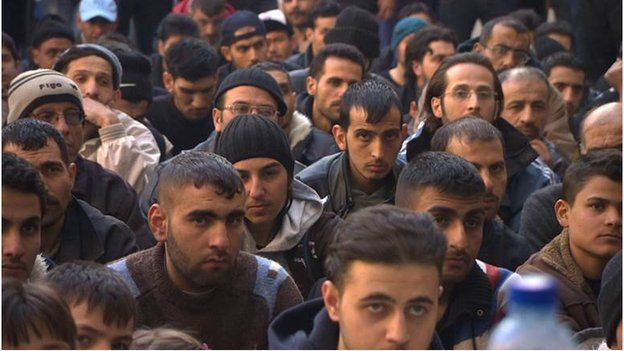 Men inside the detention centre at Homs