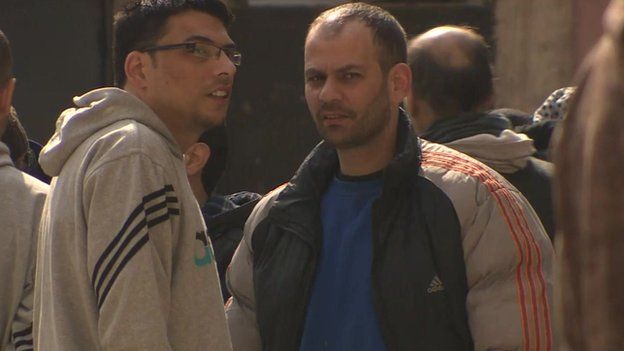 Men in courtyard of Homs detention centre