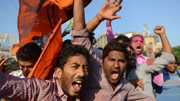 Indian supporters of Telangana state shout slogans as they celebrate the planned creation of Telangana state in Hyderabad on February 18, 2014. Indian