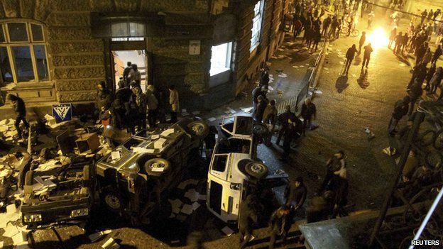 Anti-government protesters outside the district police department in Lviv.