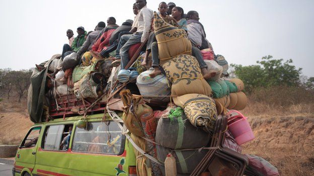 A vehicle loaded with people and their possessions fleeing CAR to Cameroon