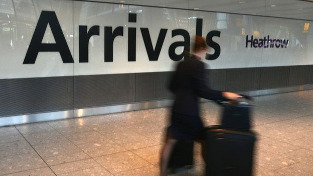 A passenger arrives in international arrivals at Heathrow Airport