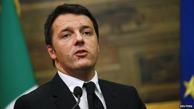 Italian Prime Minister Matteo Renzi talks to reporters at the end of talks with party leaders at the parliament in Rome