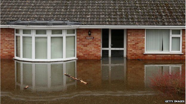 Flood water continues to surround properties in the largely evacuated village of Moorland