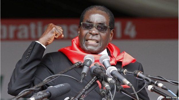 Zimbabwe's President Robert Mugabe addresses supporters during celebrations to mark his 90th birthday