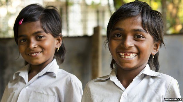 Two smiling Indian schoolgirls