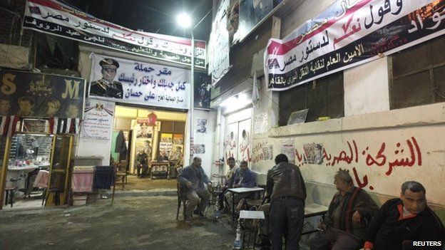 Posters of Army chief Abdel Fattah al-Sisi adorn the walls of an area of Cairo's Gamaliya district, where he spent his childhood January 21, 2014.