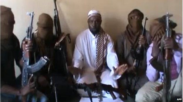 A screen grab taken from a video released on You Tube in April 2012, apparently showing Boko Haram leader Abubakar Shekau (centre) sitting flanked by militants