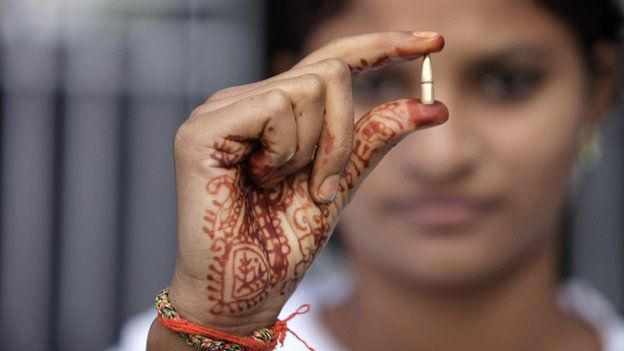 Schoolgirl in India shows bullet claimed to have been fired across border