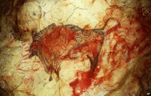 A painting of a large male bison on the ceiling of the caves' polychrome chamber, shown in a 1985 file photo