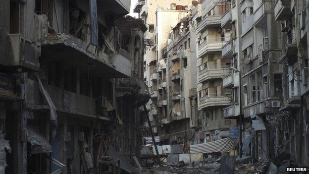 Damaged buildings are pictured in the besieged area of Homs 22 February 2014