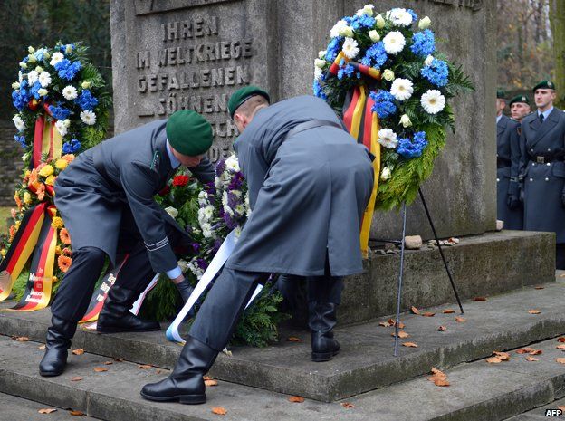 Soldiers lay down a wreath at the Jewish Cemetery in Berlin Weissensee, on November 18, 2012.