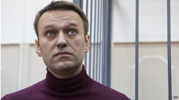 Russian opposition activist and anti-corruption crusader Alexei Navalny listens in the court room in Moscow