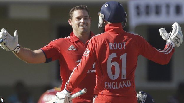 England's Michael Lumb, left, celebrates after he scored a century with Joe Root
