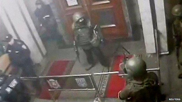 Security camera captures armed men inside regional parliament in Simferopol