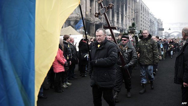 Funeral procession for victim of recent clashes with police, in Kiev on 1 March 2014