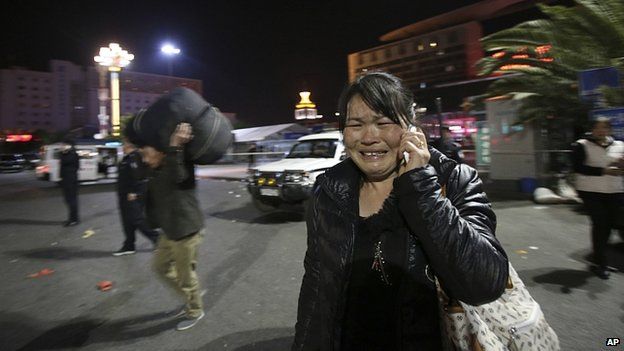 Woman cries at scene of stabbing. 1 March 2014