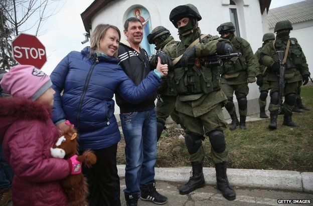 Russian soldiers with civilians outside a Ukrainian base in Perevalnoye, Crimea, 2 March