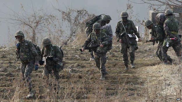 Army soldiers move during a military exercise in Paju near the border with North Korea, South Korea 28 February 2014