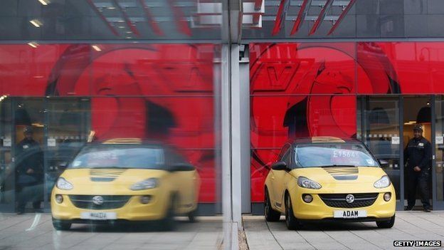 Cars are displayed for sale on the forecourt of a Vauxhall dealership on January 8, 2014 in London