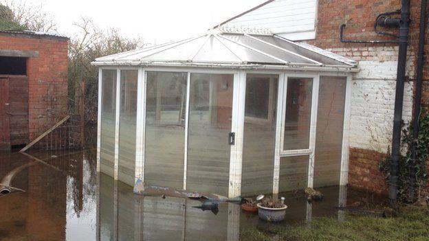 A discoloured conservatory in Moorend shows how the water levels has dropped