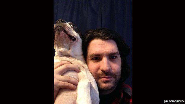 Comedian Mac Moreno poses with his dog