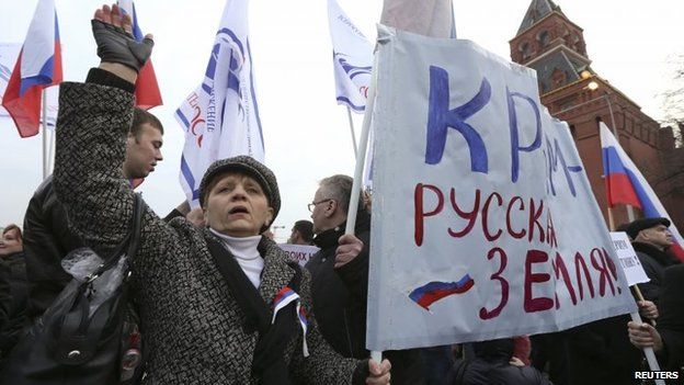 Protesters carry a banner reading "Crimea is Russian land!" at a rally in Moscow (7 March 2014)
