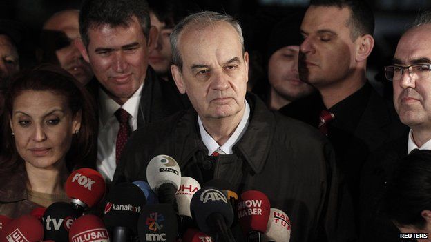 Former army chief Ilker Basbug (C) speaks to media after being released from prison outside Silivri prison complex near Istanbul on 7 March 2014.