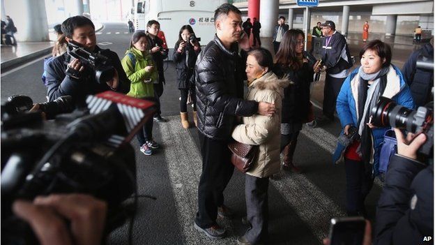 A relative of a passenger at Beijing International Airport