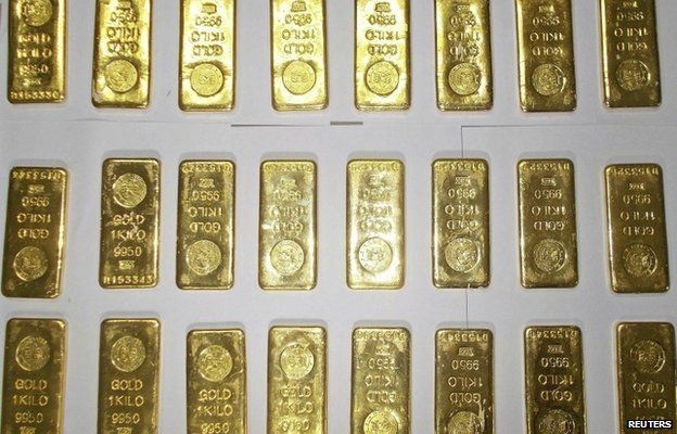 Seized gold bars are kept on display by customs officers at the international airport in Calcutta on November 19, 2013