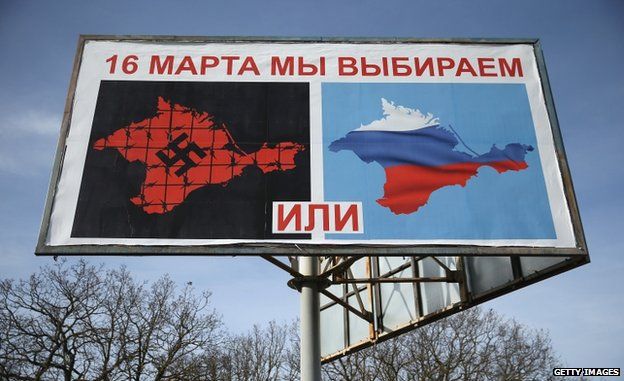 A billboard sets out the choices for the vote: Crimea with a swastika, or Crimea in Russia