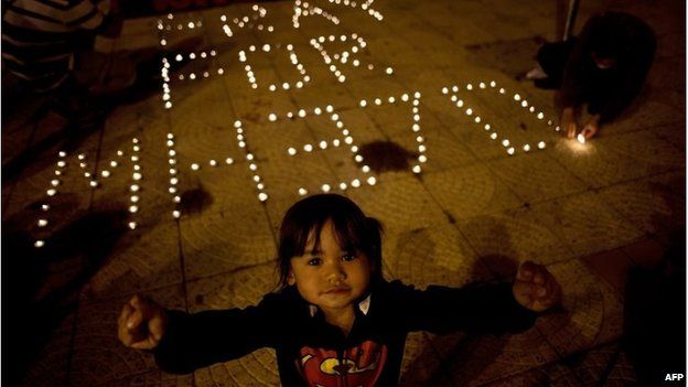 A Malaysian-Chinese child at a vigil for missing Malaysia Airlines passengers at the Independence Square in Kuala Lumpur on March 10