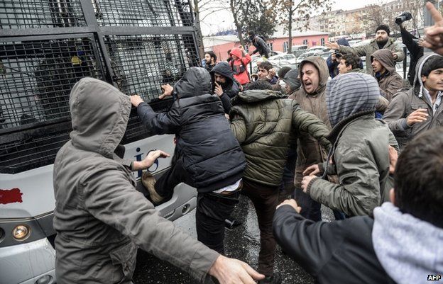 Protesters attacked a riot police vehicle outside the hospital where Berkin Elvan died