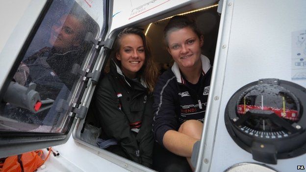Lauren Morton (left) and Hannah Lawton in the cabin of their boat