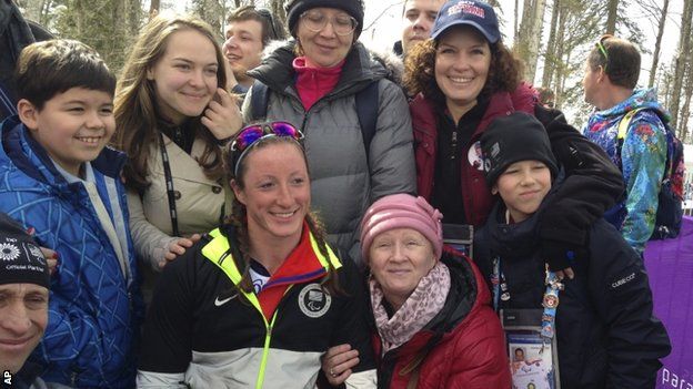 Tatyana Mcfadden of United States, second left in the first row, poses with her Russian birth mum, second right in the first row, after her race during the 12km cross country race