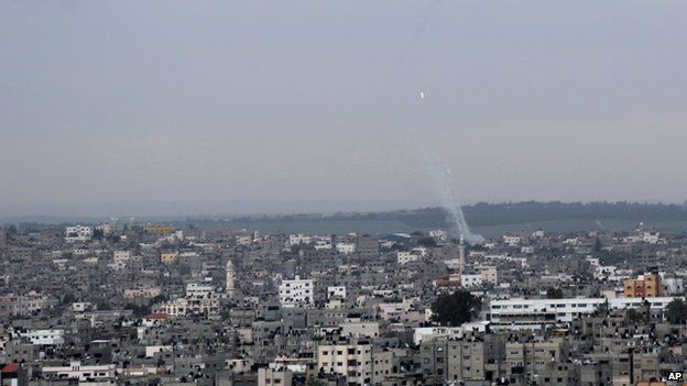 A trail of smoke from rockets fired from Gaza towards Israel was seen above Gaza City (12 March 2014)