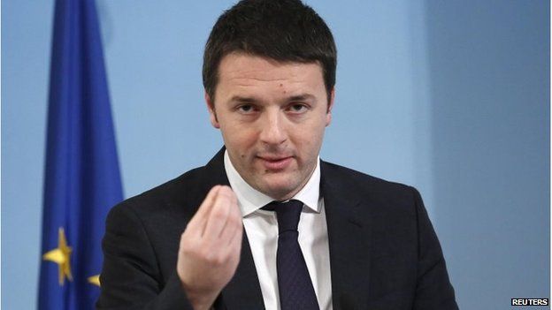 Matteo Renzi gestures as he leads a news conference at Chigi palace in Rome on 12 March