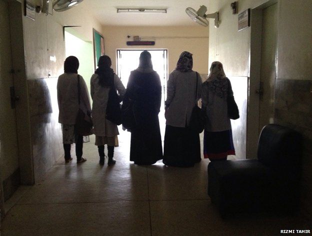 Five women in veils in a building in Pakistan