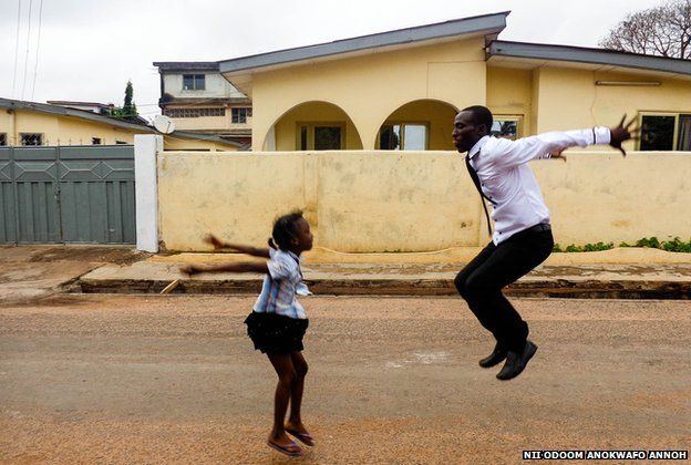 A man and girl jump