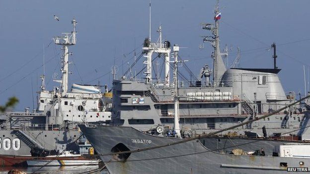 A Russian flag flies on a Ukrainian ship moored in the Crimean port of Sevastopol, 21 March